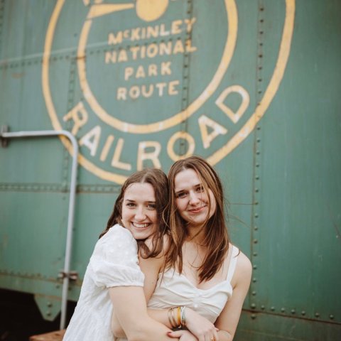 a woman holding a sign